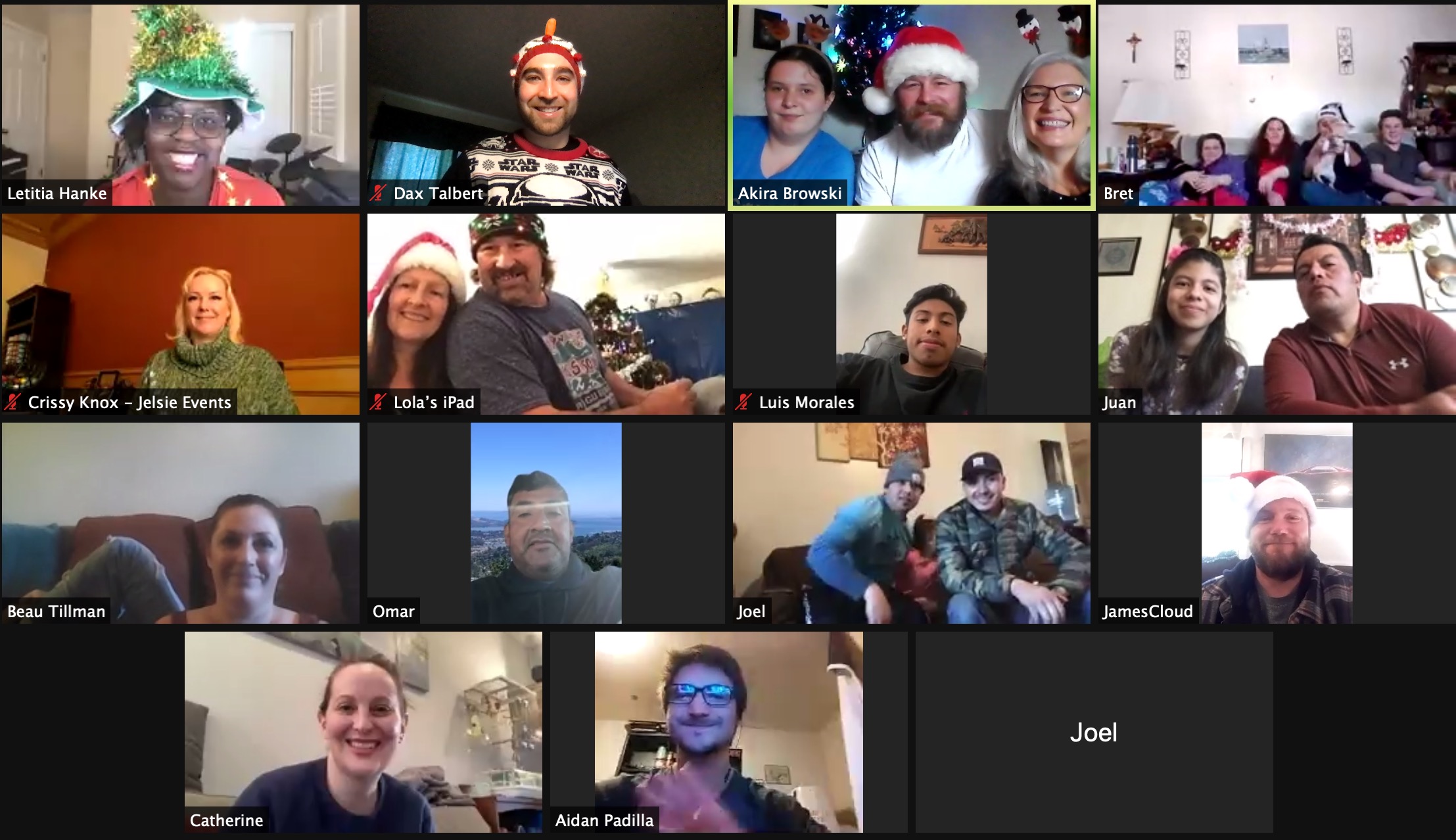 A group of people wearing christmas hats in a video call.